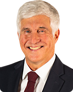 Smiling middle-aged man in a dark suit and red tie—professional headshot.