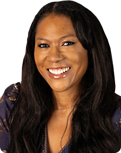 Portrait of a smiling woman with long dark hair wearing a blue patterned blouse (head and shoulders).